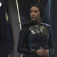 Sonequa Martin-Green's Captain Michael Burnham, dressed in Starfleet tactical gear on the bridge of the U.S.S. Discovery.